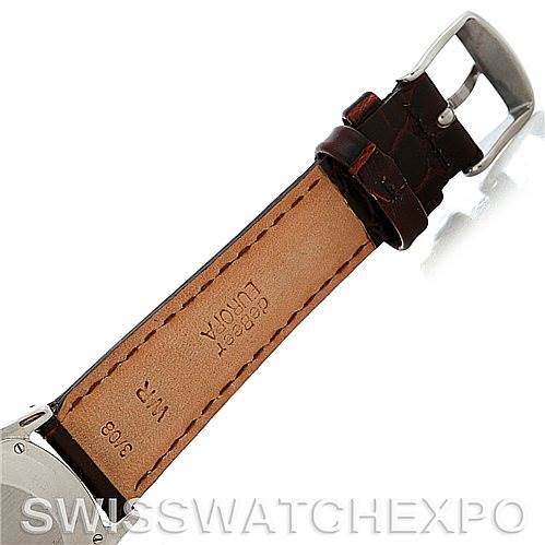 The image shows the underside of a vintage Jaeger LeCoultre watch's leather strap and buckle from a top-down angle.