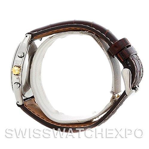 This image shows a Jaeger LeCoultre Vintage 116.5.33 Men's Stainless Steel White Dial 116.5.33 Men's Stainless Steel White Dial model watch from a side angle, highlighting the case, crown, and leather strap.