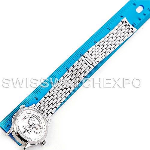 The image shows a Jaeger LeCoultre Master 142.8.92 Men's Stainless Steel Silver Dial 142.8.92 Men's Stainless Steel Silver Dial model watch, angled from above, alongside a blue measuring ruler.