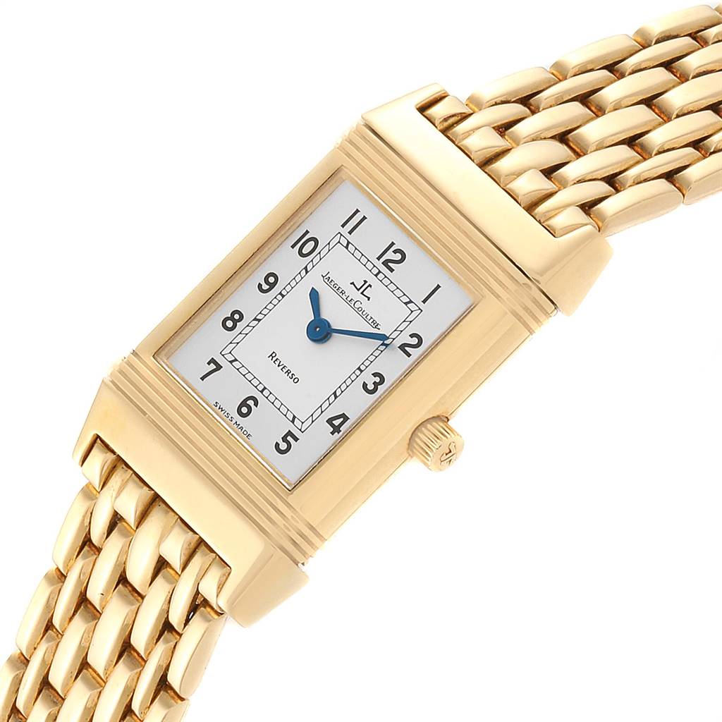 The image shows a Jaeger LeCoultre Reverso Q2611110 Women's Yellow Gold Silver Dial Q2611110 Women's Yellow Gold Silver Dial watch with a rectangular dial and gold bracelet, viewed from an angled top-down perspective.