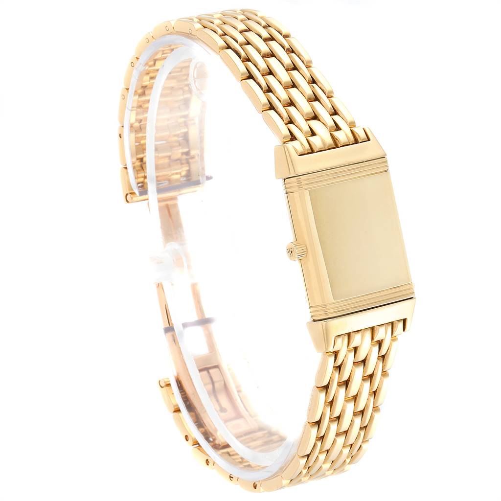 The image shows a side angle of a Jaeger-LeCoultre Reverso watch featuring a gold chain bracelet and case.