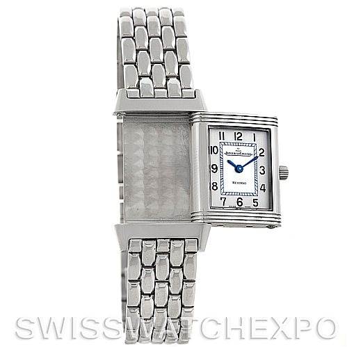 The image shows a Jaeger LeCoultre Reverso 260.8.47 Women
s Stainless Steel Silver Dial 260.8.47 Women
s Stainless Steel Silver Dial watch with its case flipped to the side, revealing the front dial and metal bracelet.