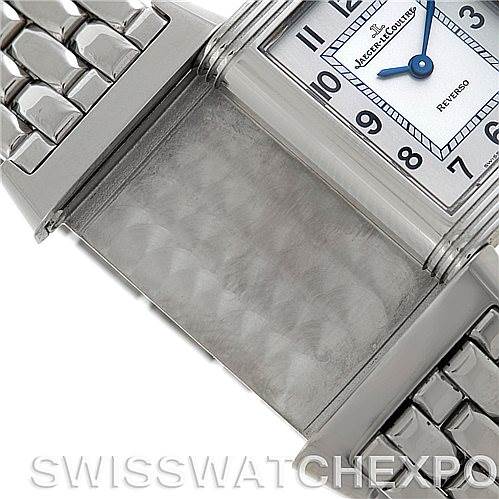 The image shows a Jaeger-LeCoultre Reverso watch with its case flipped, revealing the back and part of its bracelet.