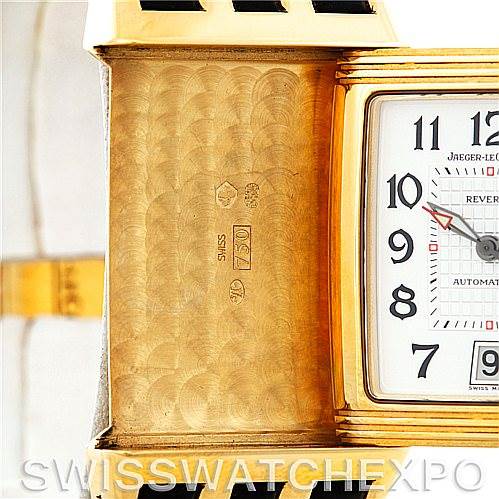This image shows the inner case and face of a Jaeger-LeCoultre Reverso watch, highlighting the engraved interior and part of the dial.