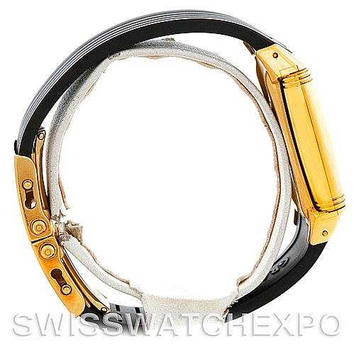 The image shows a side view of a Jaeger LeCoultre Reverso 290160 Men
s Yellow Gold Silver Dial 290160 Men
s Yellow Gold Silver Dial watch, highlighting its gold case and black straps.