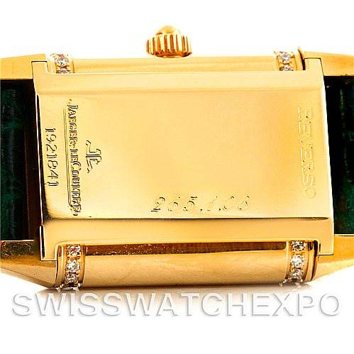 This image shows the back case of the Jaeger LeCoultre Reverso 265108 Women's Yellow Gold Silver Dial 265108 Women's Yellow Gold Silver Dial watch, focused on its engravings and the crown.