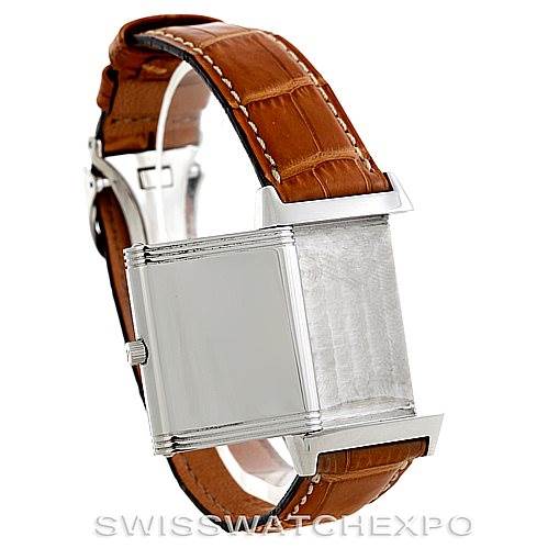 This image shows a Jaeger LeCoultre Reverso 250.84.11 Men's Stainless Steel Silver Dial 250.84.11 Men's Stainless Steel Silver Dial watch in a side angle, highlighting the back case and brown leather strap.