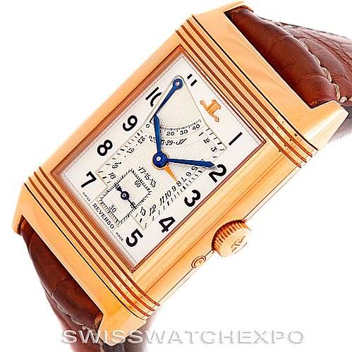 The image shows a side angle of the Jaeger-LeCoultre Reverso watch, highlighting the dial, crown, case, and brown leather strap.