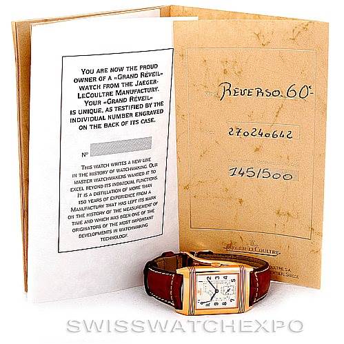 The image shows a Jaeger LeCoultre Reverso 270.2.64 Men's Rose Gold Silver Dial 270.2.64 Men's Rose Gold Silver Dial watch positioned at a front angle, accompanied by an open certificate/manual.