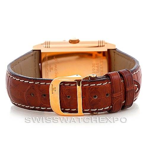 The image shows the back view of a Jaeger-LeCoultre Reverso watch, focusing on the leather strap and the buckle.