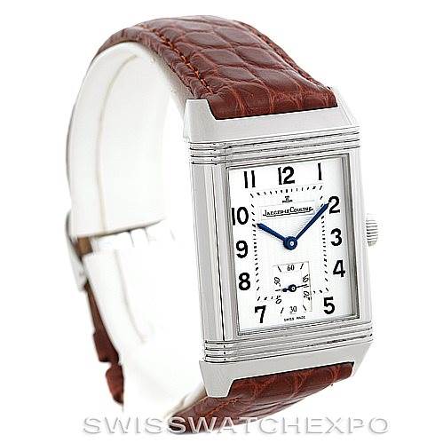 The image shows a Jaeger-LeCoultre Reverso watch at a front angle with a brown leather strap and a rectangular white dial.