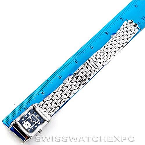 The image shows a Jaeger LeCoultre Reverso 250.8.71 Stainless Steel Blue Dial 250.8.71 Stainless Steel Blue Dial watch laid flat with its bracelet extended alongside a ruler for scale.