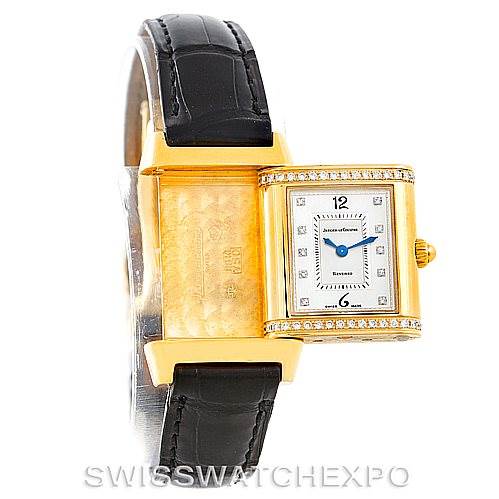 This image shows the Jaeger LeCoultre Reverso 265.1.08 Women's Yellow Gold Mother of Pearl Dial 265.1.08 Women's Yellow Gold Mother of Pearl Dial watch at an angle displaying the front face and its unique reversible mechanism.