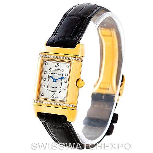 This image shows a Jaeger LeCoultre Reverso 265.1.08 Women's Yellow Gold Mother of Pearl Dial 265.1.08 Women's Yellow Gold Mother of Pearl Dial model watch at an angled side view, highlighting its gold case, black leather strap, and diamond accents.