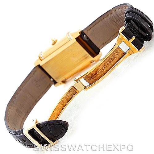 The image shows the underside and clasp of a Jaeger LeCoultre Reverso 265.1.08 Women's Yellow Gold Mother of Pearl Dial 265.1.08 Women's Yellow Gold Mother of Pearl Dial watch, highlighting the branding and leather strap.