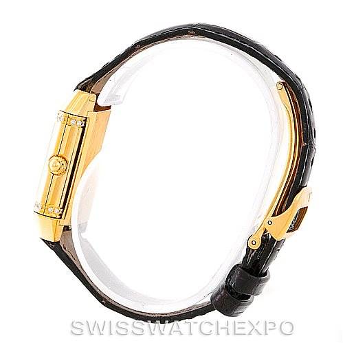 This side view of the Jaeger-LeCoultre Reverso watch shows the case, crown, and leather strap with buckle.