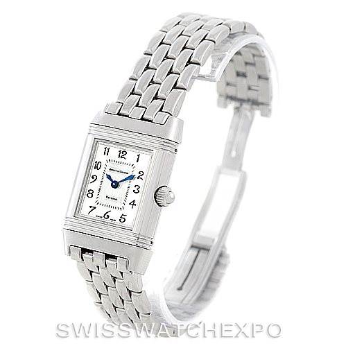 The image shows the Jaeger-LeCoultre Reverso watch at an angle displaying its face, crown, and metal bracelet.