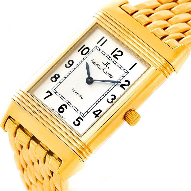 The Jaeger LeCoultre Reverso 250.1.86 Men
s Yellow Gold Silver Dial 250.1.86 Men
s Yellow Gold Silver Dial watch is shown at an oblique angle highlighting the face, crown, and part of the gold band.