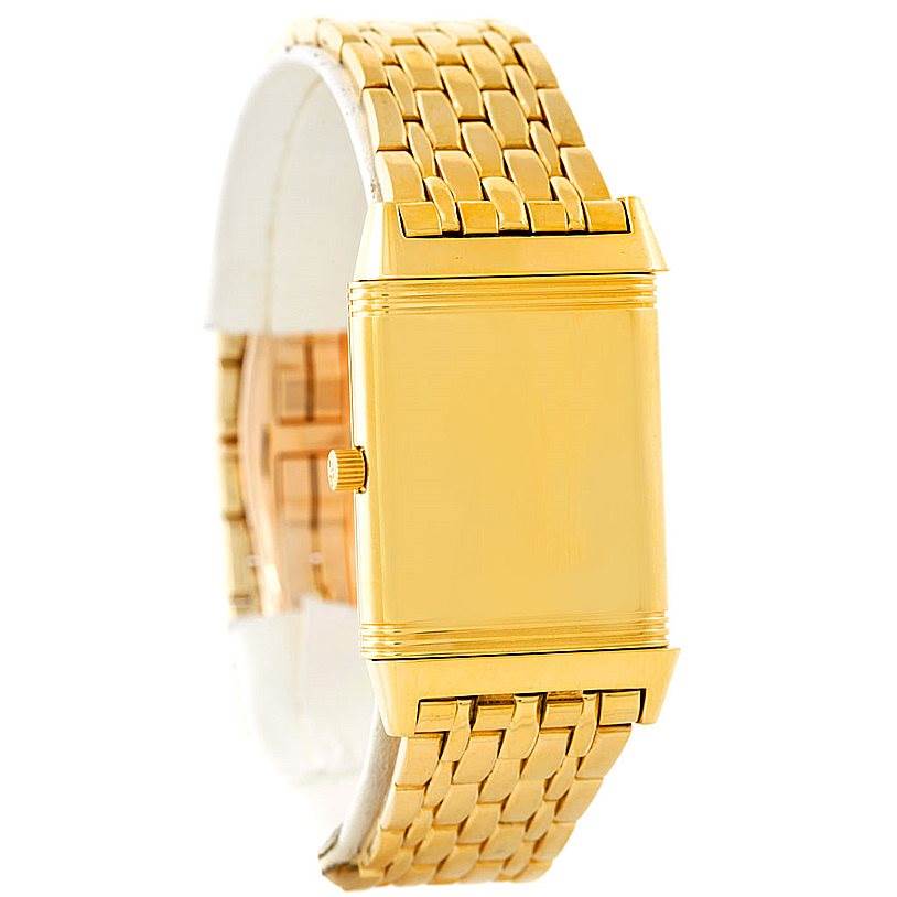 The image shows a side view of the gold Jaeger LeCoultre Reverso 250.1.86 Men
s Yellow Gold Silver Dial 250.1.86 Men
s Yellow Gold Silver Dial watch highlighting the rectangular case and metal bracelet.