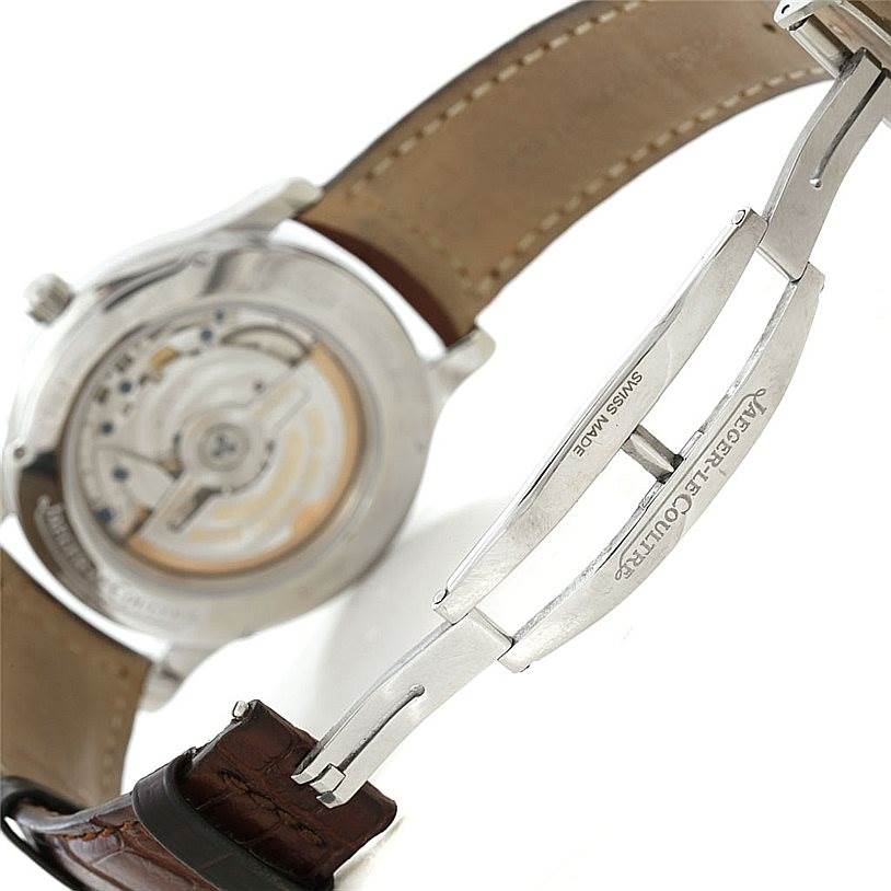 The image shows the back view of a Jaeger LeCoultre Master 147.8.37.S Men's Stainless Steel Silver Dial 147.8.37.S Men's Stainless Steel Silver Dial watch, highlighting its open case back and leather strap with a deployant clasp.