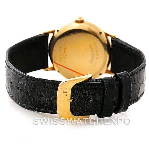 This image shows the back angle of a Vintage Jaeger LeCoultre watch, featuring the case back and leather strap with the buckle.