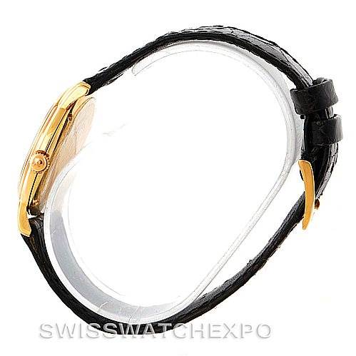 This image displays a Jaeger LeCoultre Vintage 162.7.81 Men's Yellow Gold White Dial 162.7.81 Men's Yellow Gold White Dial model watch from the side, showcasing its case, crown, and leather strap.