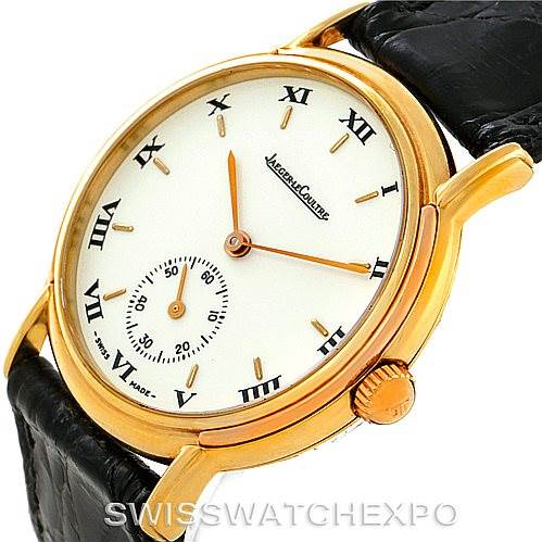 The image shows a Jaeger LeCoultre Vintage 162.7.81 Men's Yellow Gold White Dial 162.7.81 Men's Yellow Gold White Dial model watch at an angle, highlighting the dial, case, crown, and leather strap.