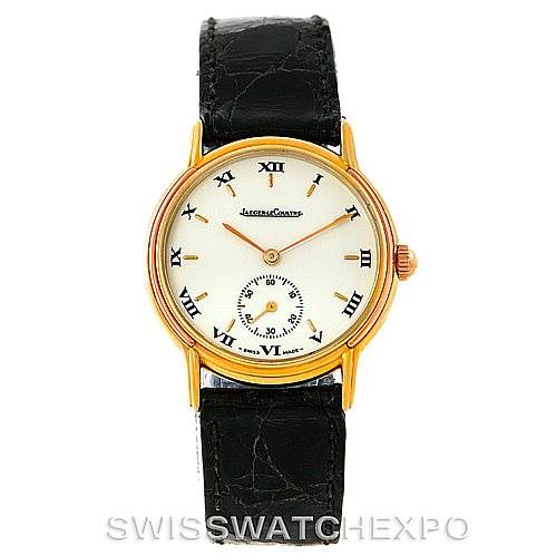 This image shows a front view of a vintage Jaeger LeCoultre watch with a white dial, Roman numerals, gold case, and black leather strap.