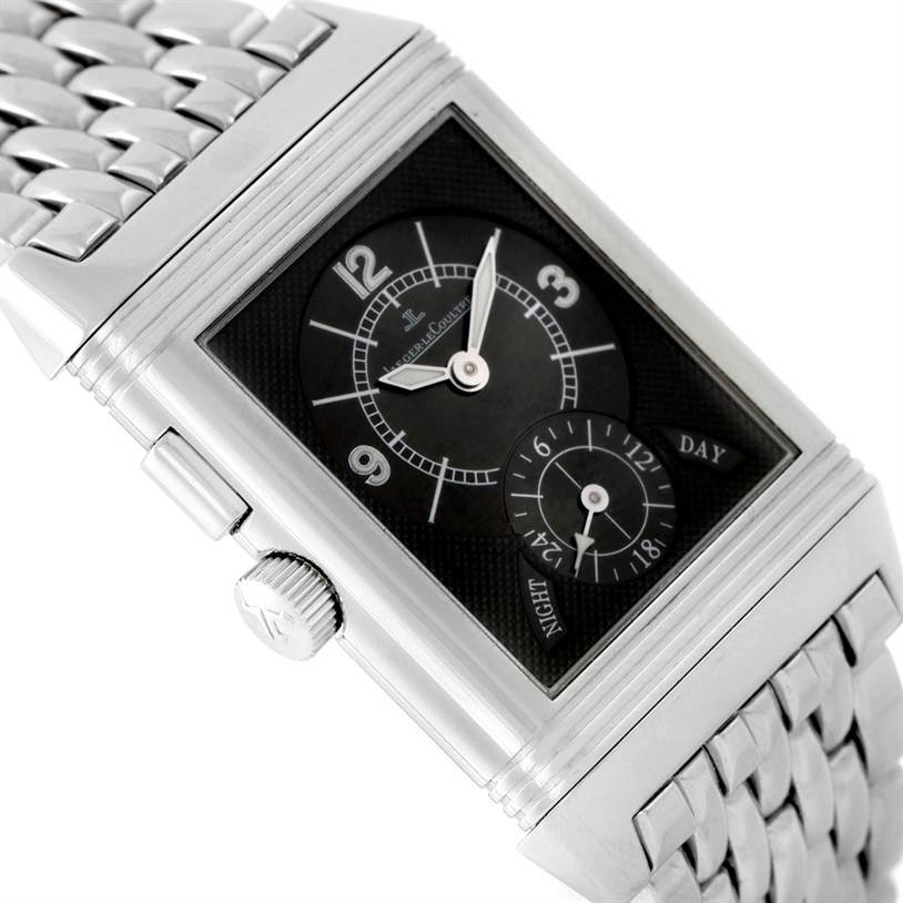 The image displays a Reverso watch by Jaeger LeCoultre at an angle highlighting the face, crown, and metallic bracelet.