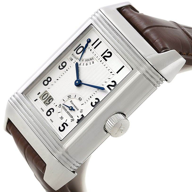 This image shows a close-up angle of the dial, case, crown, and part of the leather strap of the Jaeger LeCoultre Reverso 240.8.15 Men's Stainless Steel Silver Dial 240.8.15 Men's Stainless Steel Silver Dial watch.