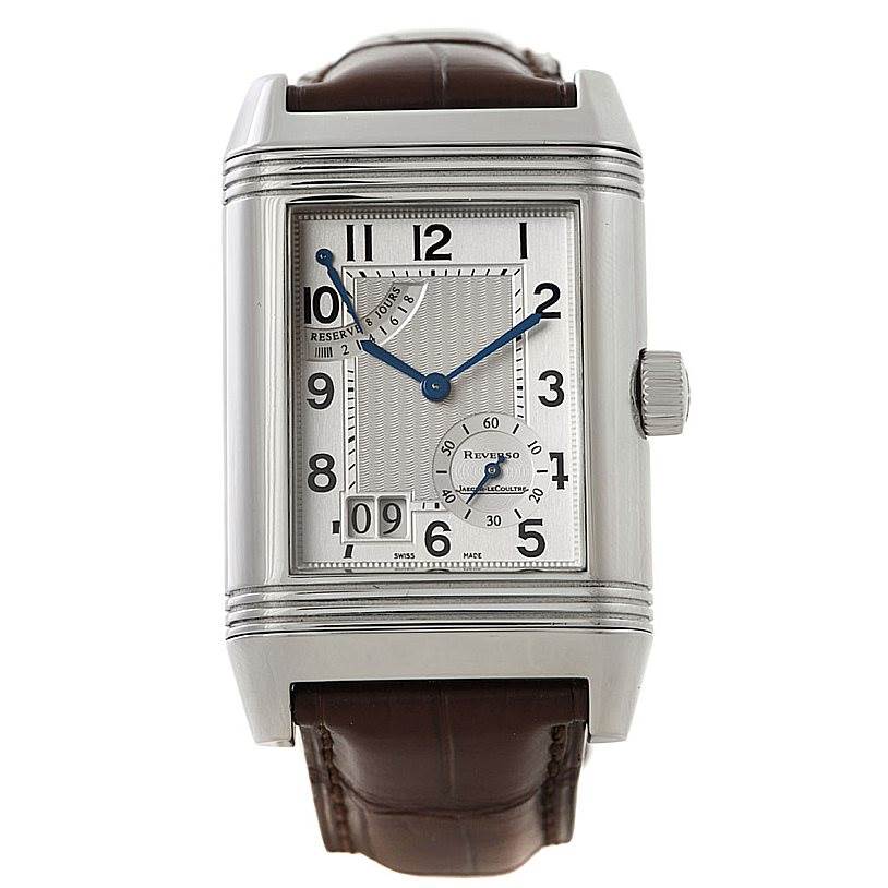 The image shows a front view of a Jaeger-LeCoultre Reverso watch, displaying its dial, crown, and leather band.