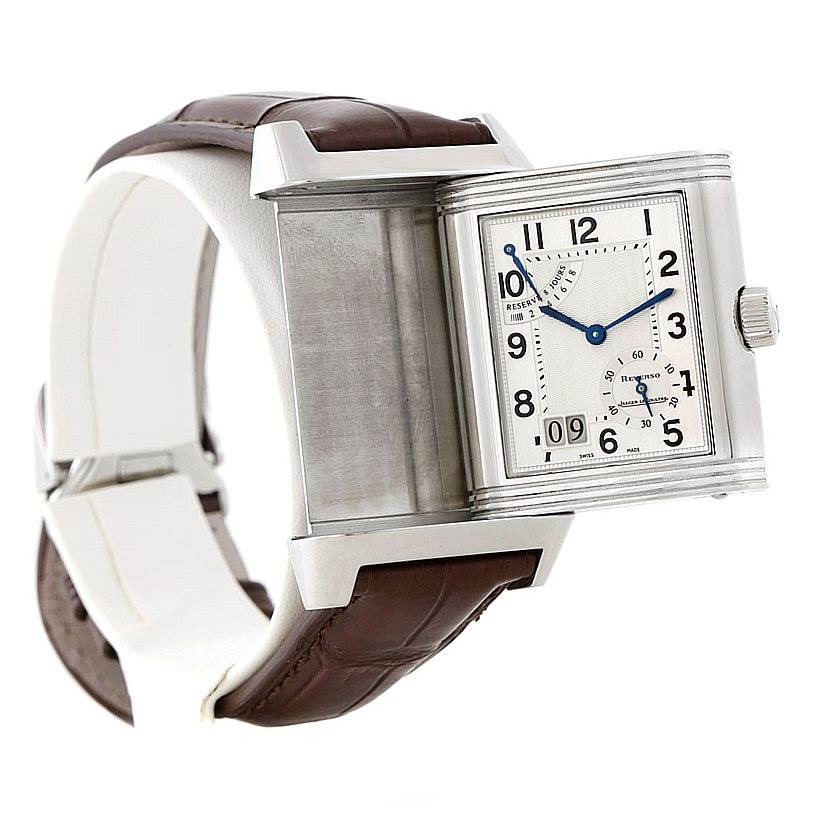 This image shows a partially rotated Jaeger LeCoultre Reverso 240.8.15 Men's Stainless Steel Silver Dial 240.8.15 Men's Stainless Steel Silver Dial watch, displaying its brown strap and silver-tone case.