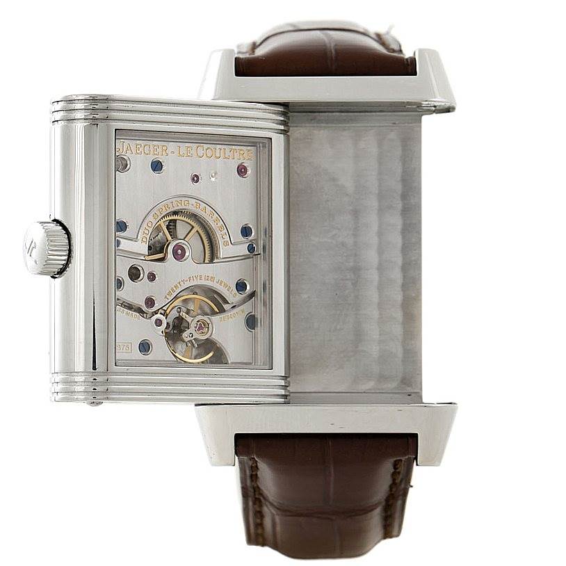 The image shows a partially rotated Jaeger LeCoultre Reverso 240.8.15 Men's Stainless Steel Silver Dial 240.8.15 Men's Stainless Steel Silver Dial watch, revealing the movement and inner mechanism, with a brown leather strap.