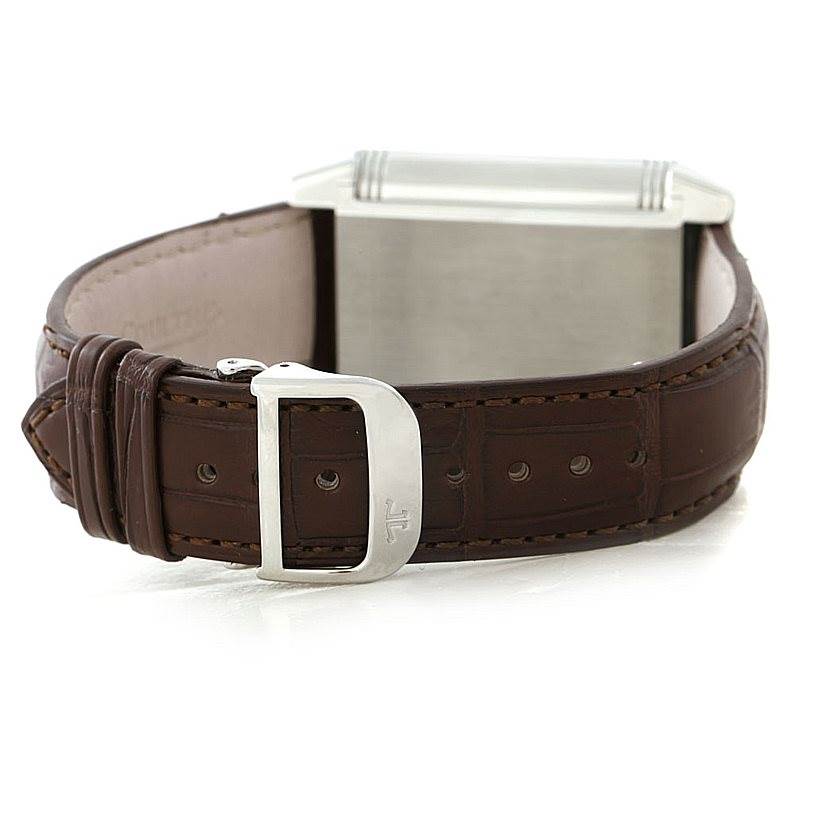 The image shows the back and side view of a Jaeger LeCoultre Reverso 240.8.15 Men's Stainless Steel Silver Dial 240.8.15 Men's Stainless Steel Silver Dial watch with a brown leather strap and a silver buckle.