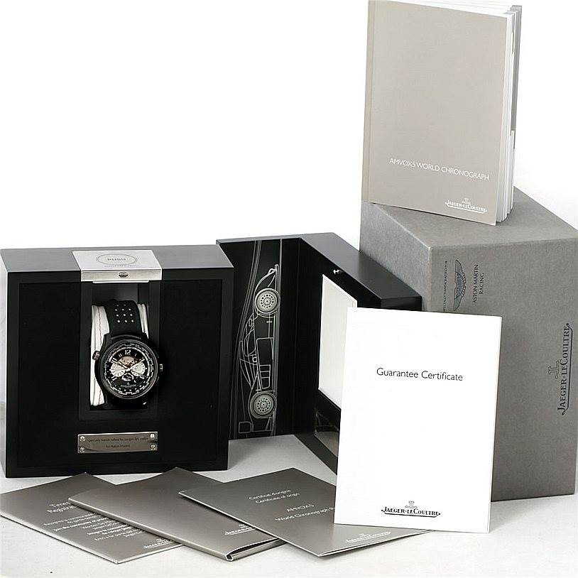 The image shows a Jaeger LeCoultre Amvox 193.J.471 Men's Stainless Steel Black Dial 193.J.471 Men's Stainless Steel Black Dial watch in its case, accompanied by booklets and a guarantee certificate, viewed from the front angle.