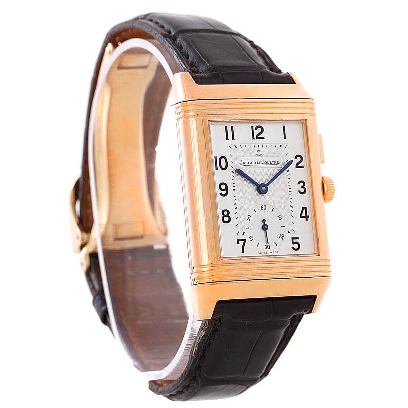 The Jaeger LeCoultre Reverso 272.251 Men's Rose Gold Silver Dial 272.251 Men's Rose Gold Silver Dial watch is shown at a slight angle, highlighting its rectangular face, strap, and side crown.