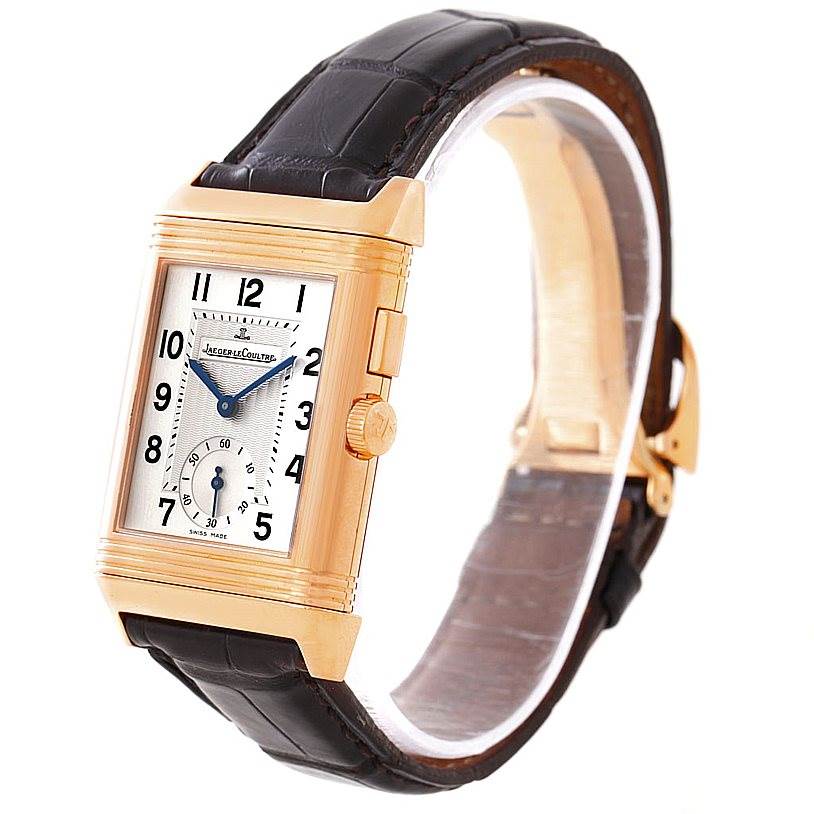 The image shows a Jaeger LeCoultre Reverso 272.251 Men's Rose Gold Silver Dial 272.251 Men's Rose Gold Silver Dial watch angled slightly to the right, highlighting its rectangular dial, crown, and leather strap.