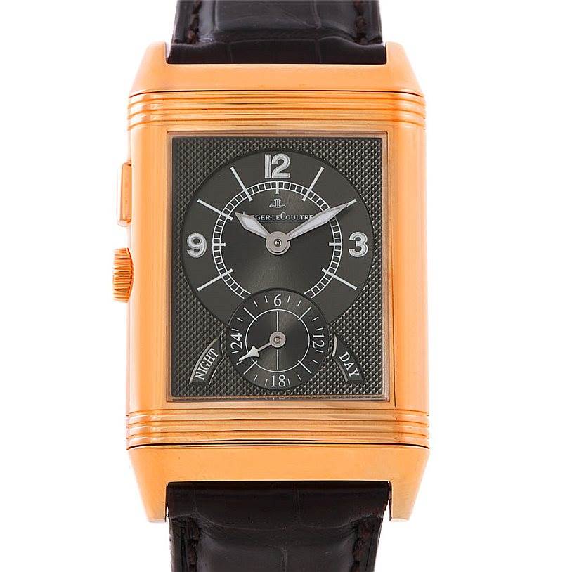 This image shows a front view of the Jaeger-LeCoultre Reverso watch, highlighting its gold case and leather strap.