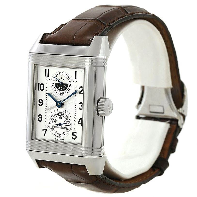 The image shows the Jaeger LeCoultre Reverso 240.8.72 Men's Stainless Steel Silver Dial 240.8.72 Men's Stainless Steel Silver Dial watch at an angle, detailing the face, crown, and leather strap.