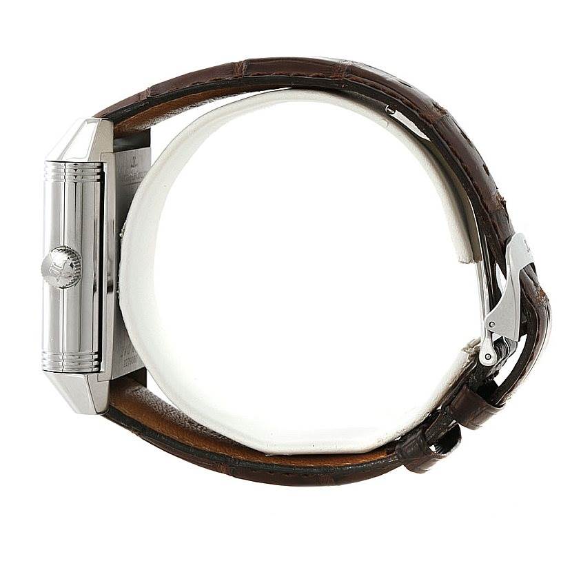 The image shows a side view of the Jaeger-LeCoultre Reverso watch featuring its crown, case, and leather strap.
