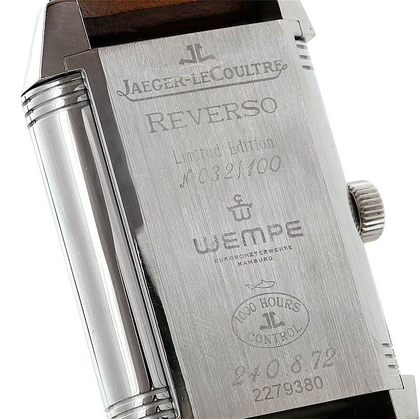 The image shows the back of the Jaeger-LeCoultre Reverso watch, highlighting its engravings, crown, and part of the case.