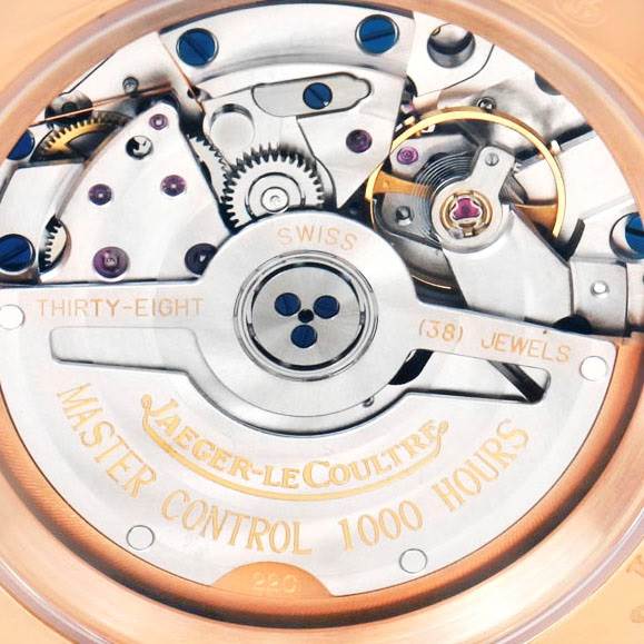 The image shows the back view of the Master model by Jaeger-LeCoultre, displaying the detailed inner mechanisms and inscriptions.