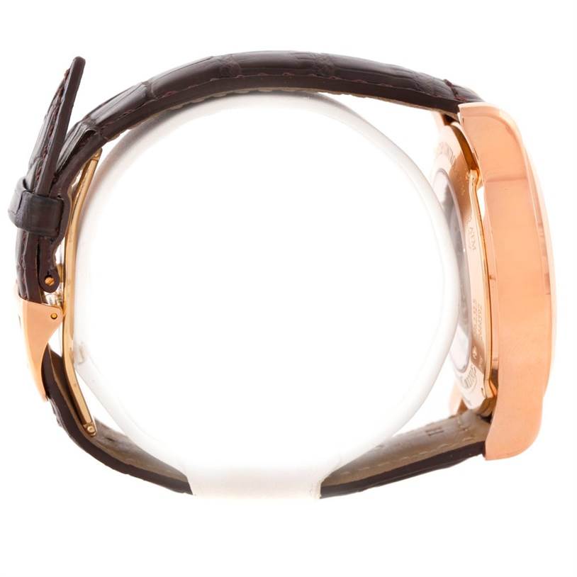 This side view of the Jaeger LeCoultre Master Q1522420 Men's Rose Gold Silver Dial Q1522420 Men's Rose Gold Silver Dial model watch shows the case and leather strap.