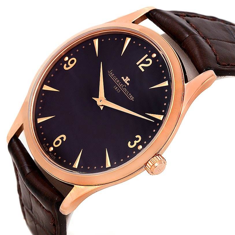 This image shows a Jaeger LeCoultre Master 142.2.92 Men
s Rose Gold Brown Dial 142.2.92 Men
s Rose Gold Brown Dial model watch from an angled side view, featuring its dial, case, and brown leather strap.