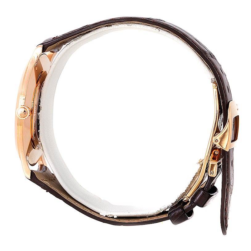 The image shows a Jaeger LeCoultre Master 142.2.92 Men
s Rose Gold Brown Dial 142.2.92 Men
s Rose Gold Brown Dial watch from a side angle, highlighting the case, crown, and leather strap with clasp.