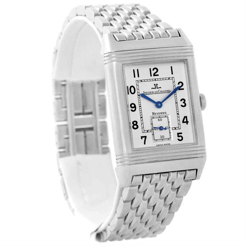 The image shows a Jaeger LeCoultre Reverso 270.8.62 Men's Stainless Steel Silver Dial 270.8.62 Men's Stainless Steel Silver Dial watch at a slight diagonal angle, displaying its rectangular face, blue hands, and silver bracelet.