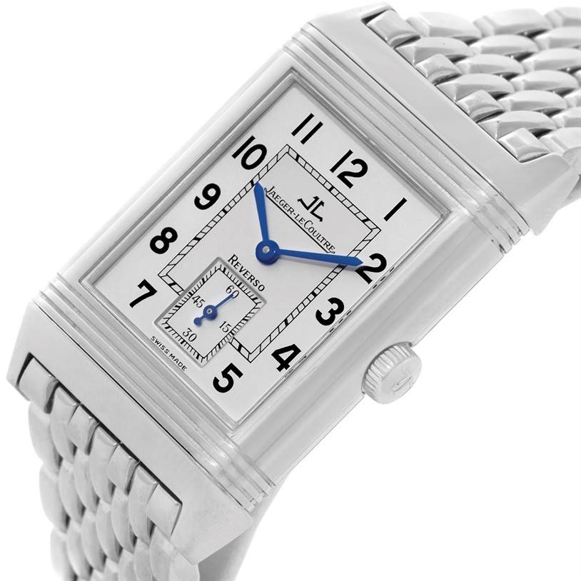 This image displays a Jaeger-LeCoultre Reverso watch at an angle, showing the watch face, crown, and part of the metal bracelet.