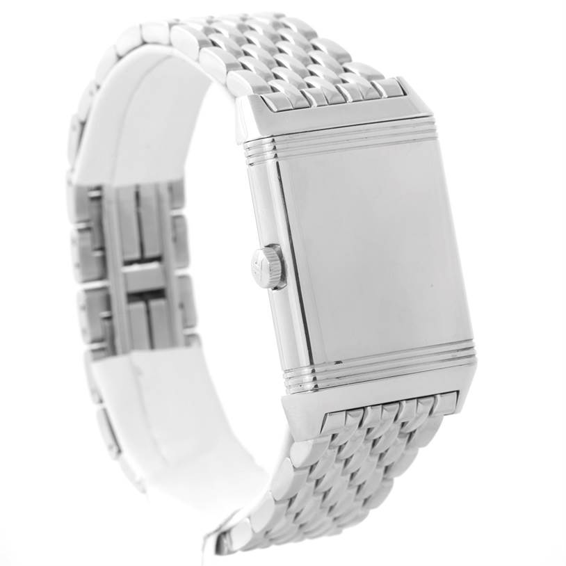 The image shows a side view of the Reverso model by Jaeger LeCoultre, highlighting its crown and metal bracelet.