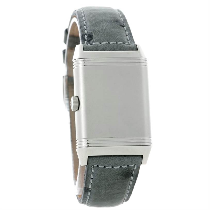 The image shows a side angle of the Jaeger LeCoultre Reverso 271.8.61 Men's Stainless Steel Grey Dial 271.8.61 Men's Stainless Steel Grey Dial watch, highlighting its crown and leather strap.