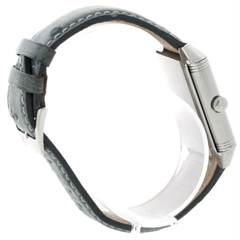 The image shows a side profile of the Jaeger LeCoultre Reverso 271.8.61 Men's Stainless Steel Grey Dial 271.8.61 Men's Stainless Steel Grey Dial watch, highlighting its crown and leather strap.